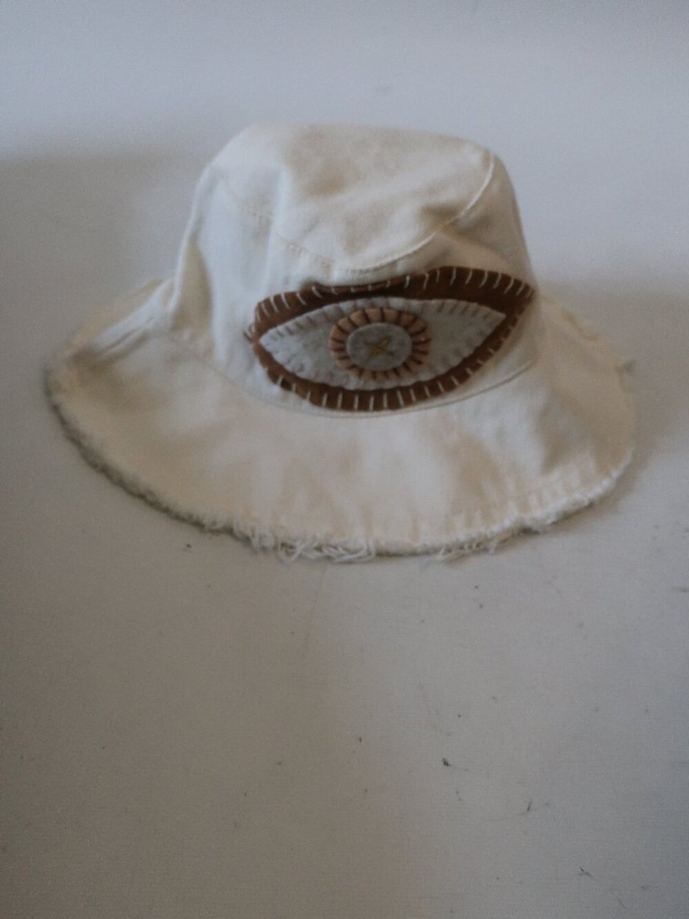 NWT Womens Romi Basha Off White Canvas Bucket Hat W/Evil Eye